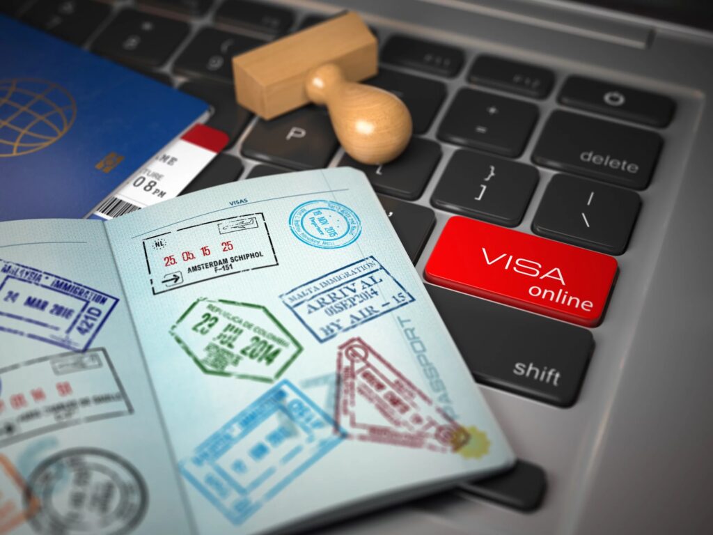 Online Visa Button with Passport Stamps | Consular Processing Expert | U.S. Immigration Law Counsel