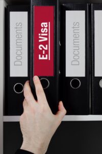 E-2 binder in red next to binders that say Document