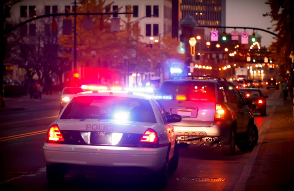 A police car pulling over a vehicle