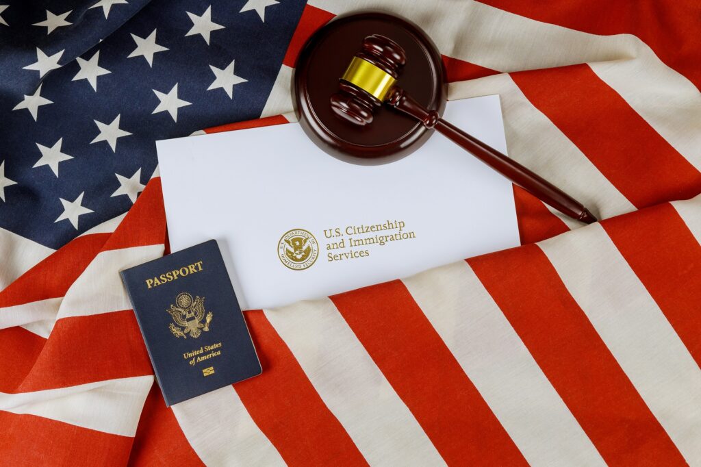 American Flag and Passport with a USCIS Envelope | Citizenship Lawyer | U.S. Immigration Law Counsel