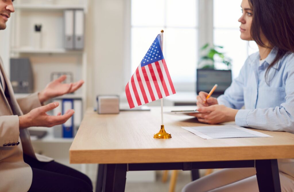 Gentleman meeting with woman attorney going over documents