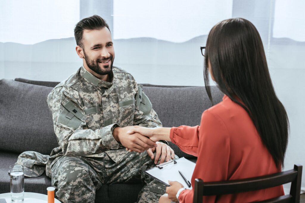 Soldier & Legal Professional Shakes Hands | Military Citizenship Lawyer | US Immigration Law Counsel