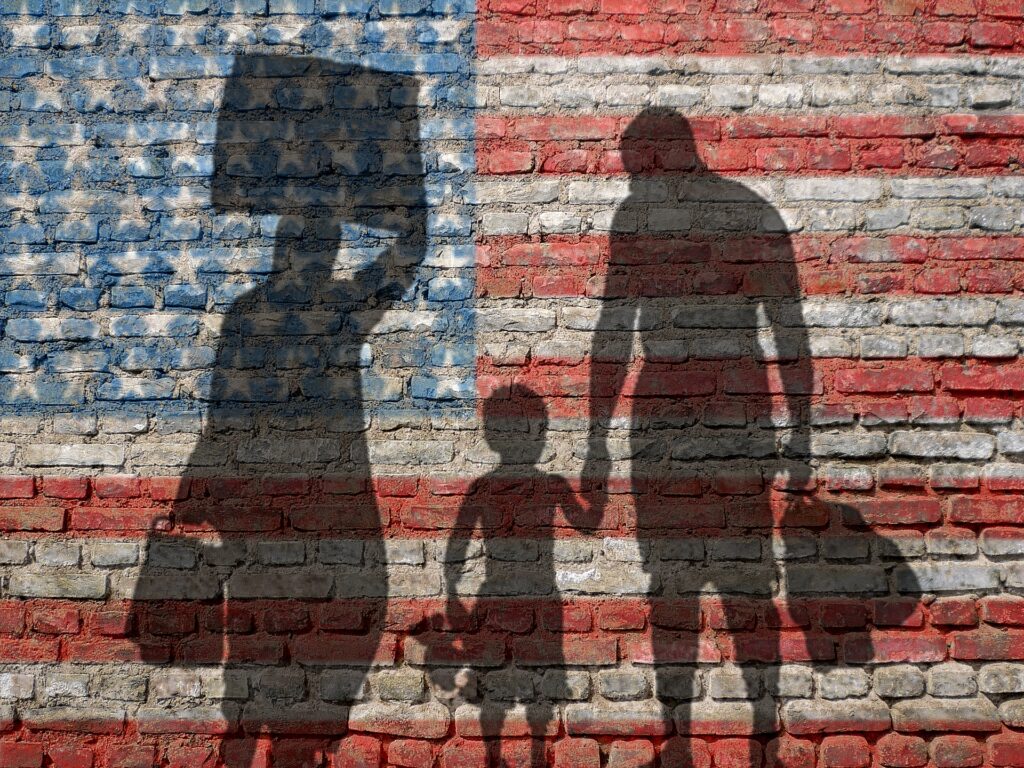 Shadow of Family with American Flag Background | Reliable Family Visa | U.S. Immigration Law Counsel